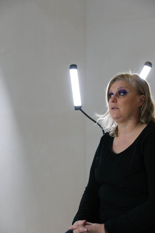 Woman with blonde hair looking up during inkless scar reduction treatment at Resolute Repair Studio in Melbourne